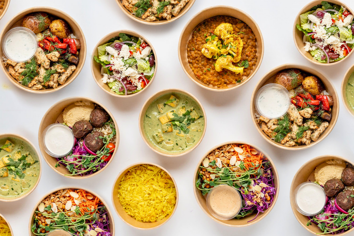 Selection of The Conscious Farm Kitchen meals in compostable containers.